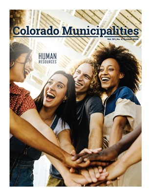 Colorado Municipalities - October 2025 cover of the july magazine featuring a mountain road that curves